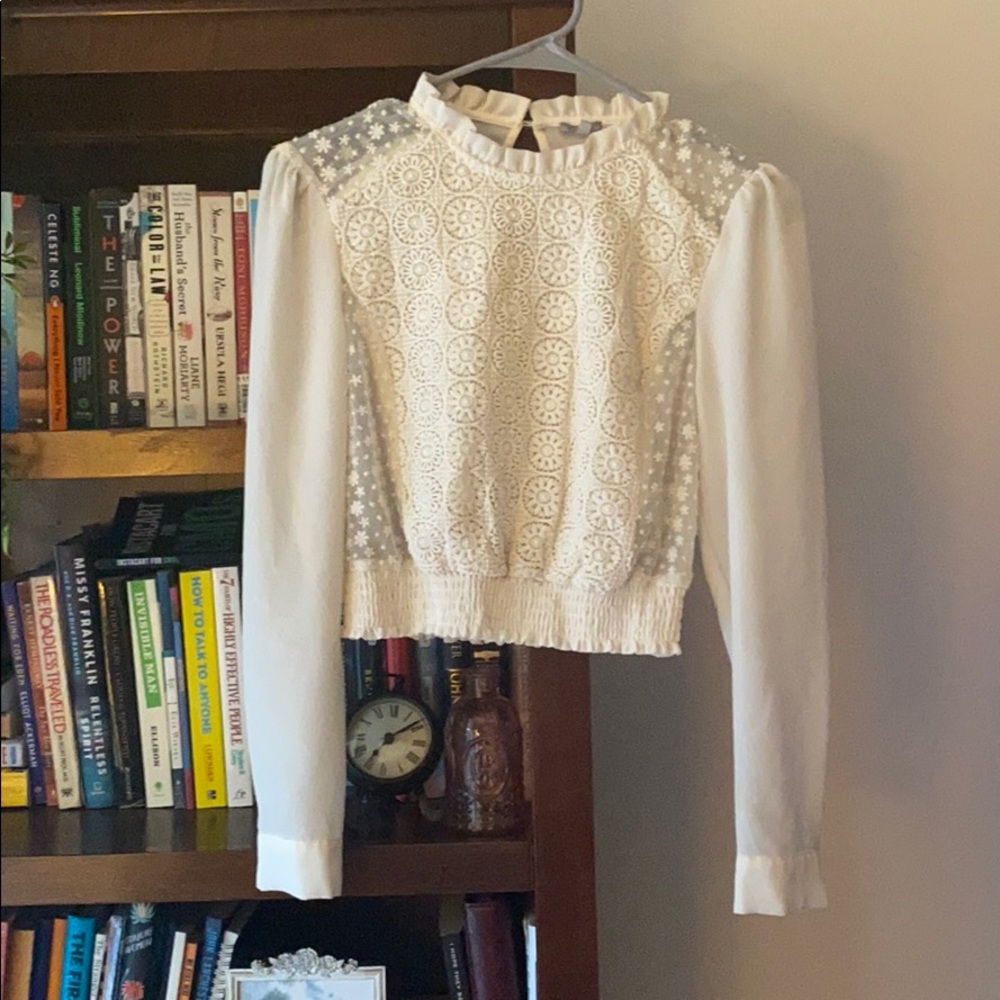 Cream colored long sleeve blouse